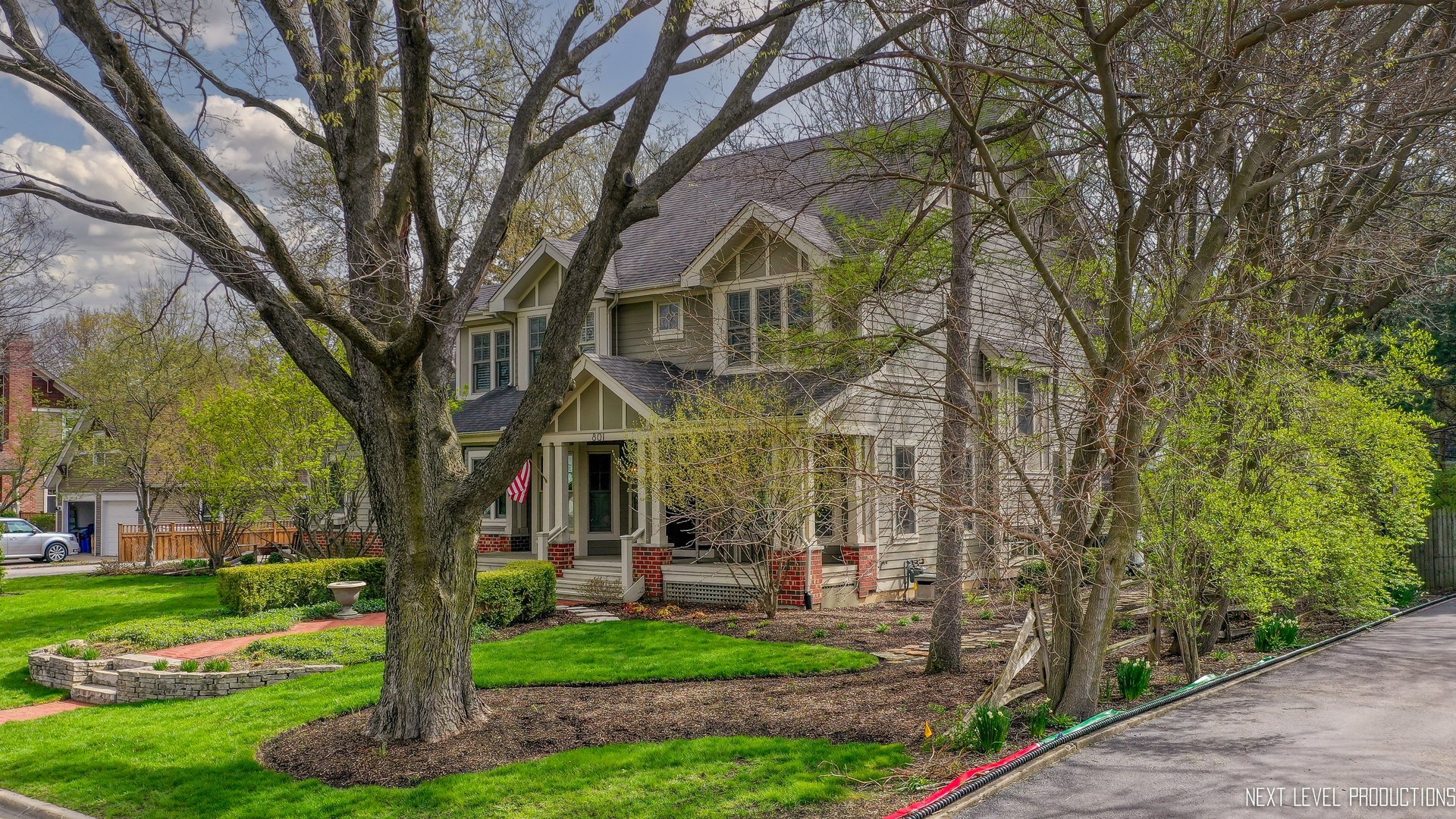 801 Meadows Road Geneva, IL 60134 - Photo 4 of 14 a front view of a house with garden