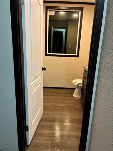 a view of a bathroom from a door