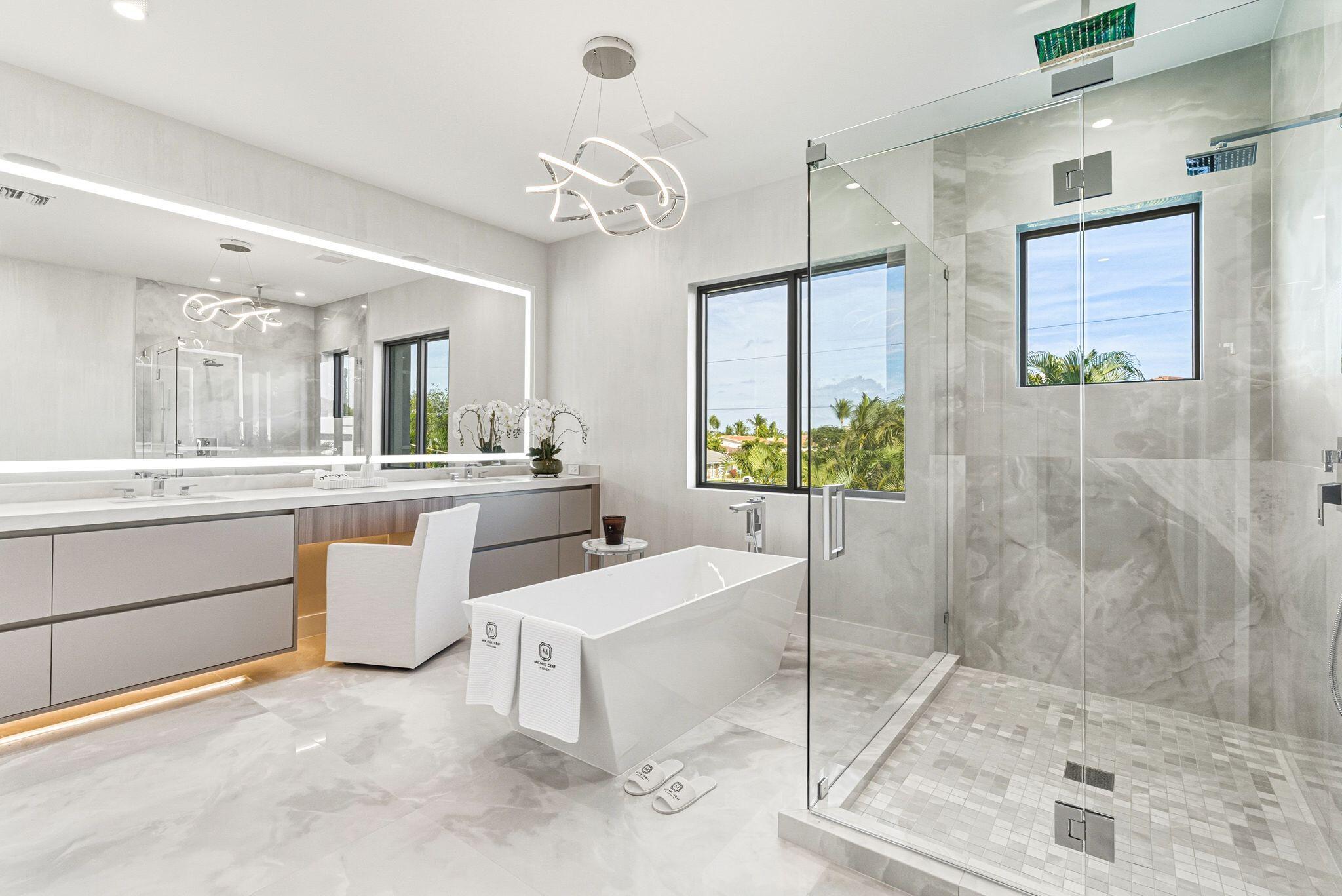 1050 Northeast 3rd Avenue Boca Raton, FL 33432 - Photo 11 of 63 a large white kitchen with a sink and refrigerator