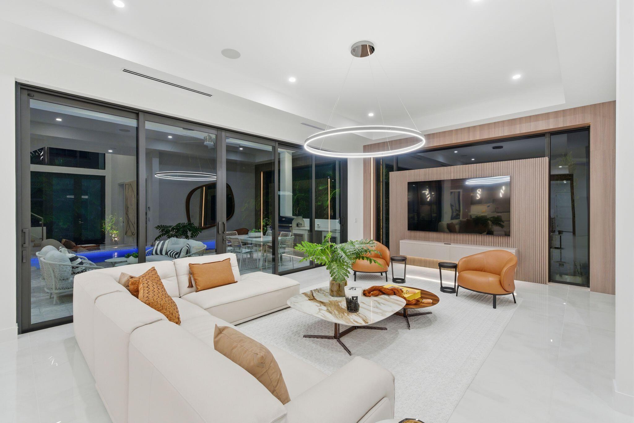 1050 Northeast 3rd Avenue Boca Raton, FL 33432 - Photo 20 of 63 a living room with furniture and a large window
