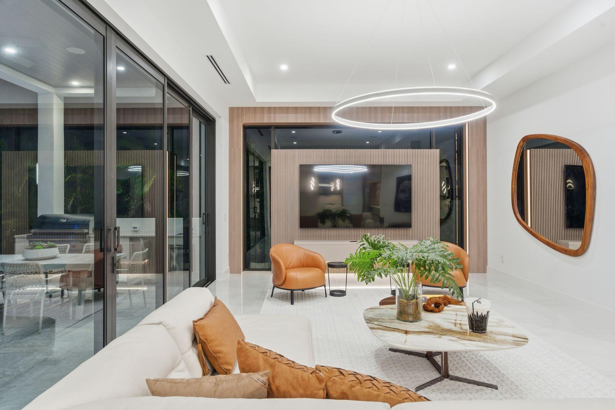1050 Northeast 3rd Avenue Boca Raton, FL 33432 - Photo 21 of 63 a living room with furniture and a large window