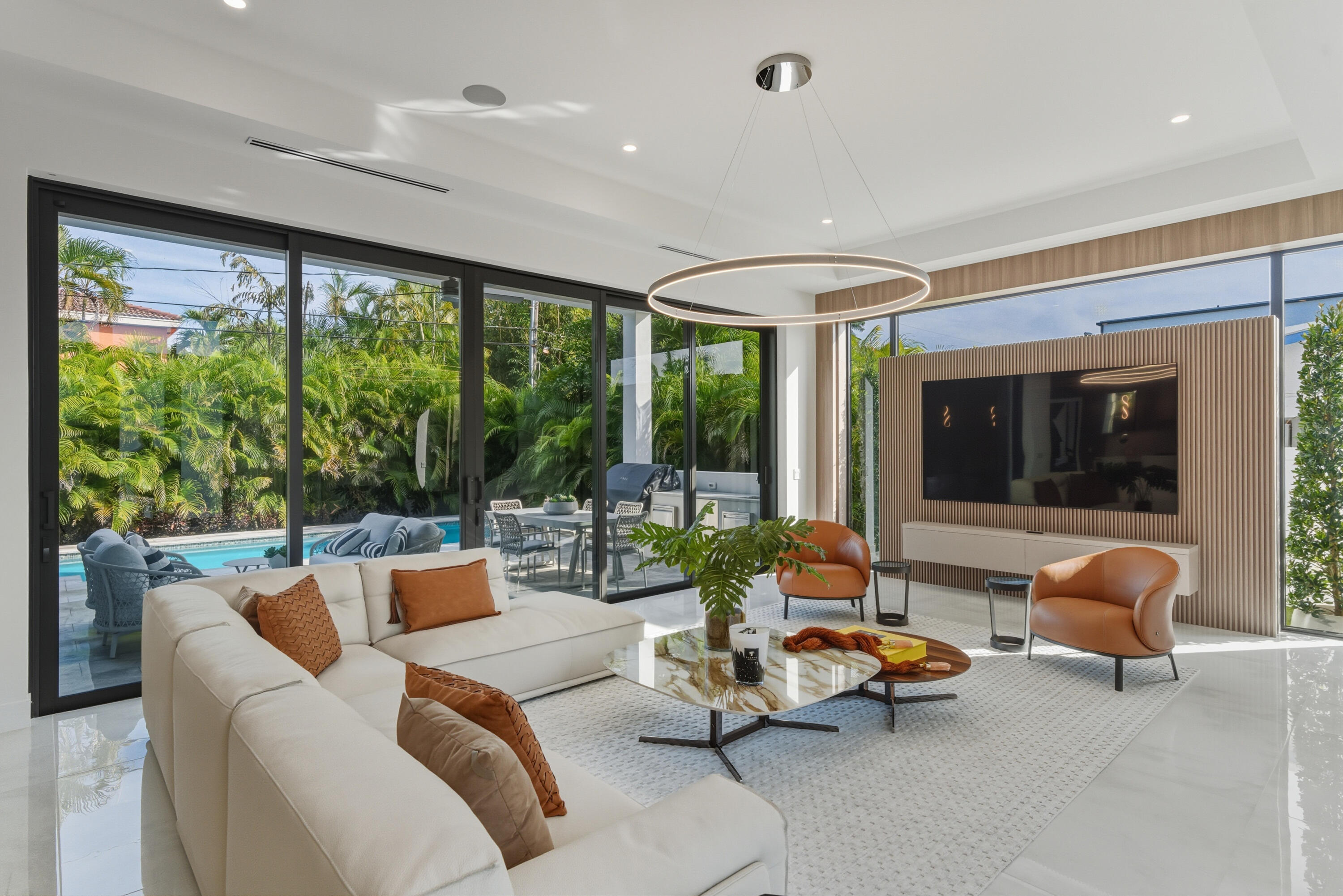 1050 Northeast 3rd Avenue Boca Raton, FL 33432 - Photo 3 of 63 a living room with furniture and floor to ceiling windows