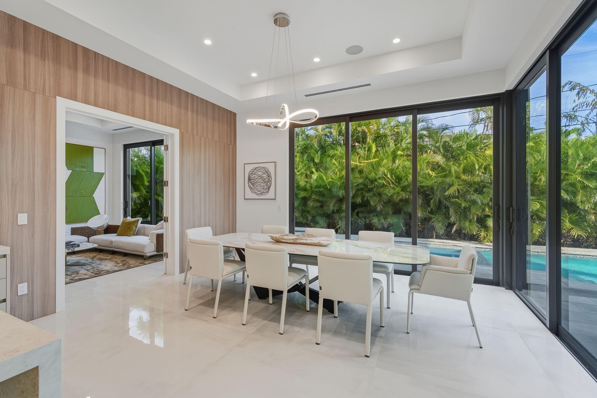 1050 Northeast 3rd Avenue Boca Raton, FL 33432 - Photo 37 of 63 a view of a patio with a table and chairs