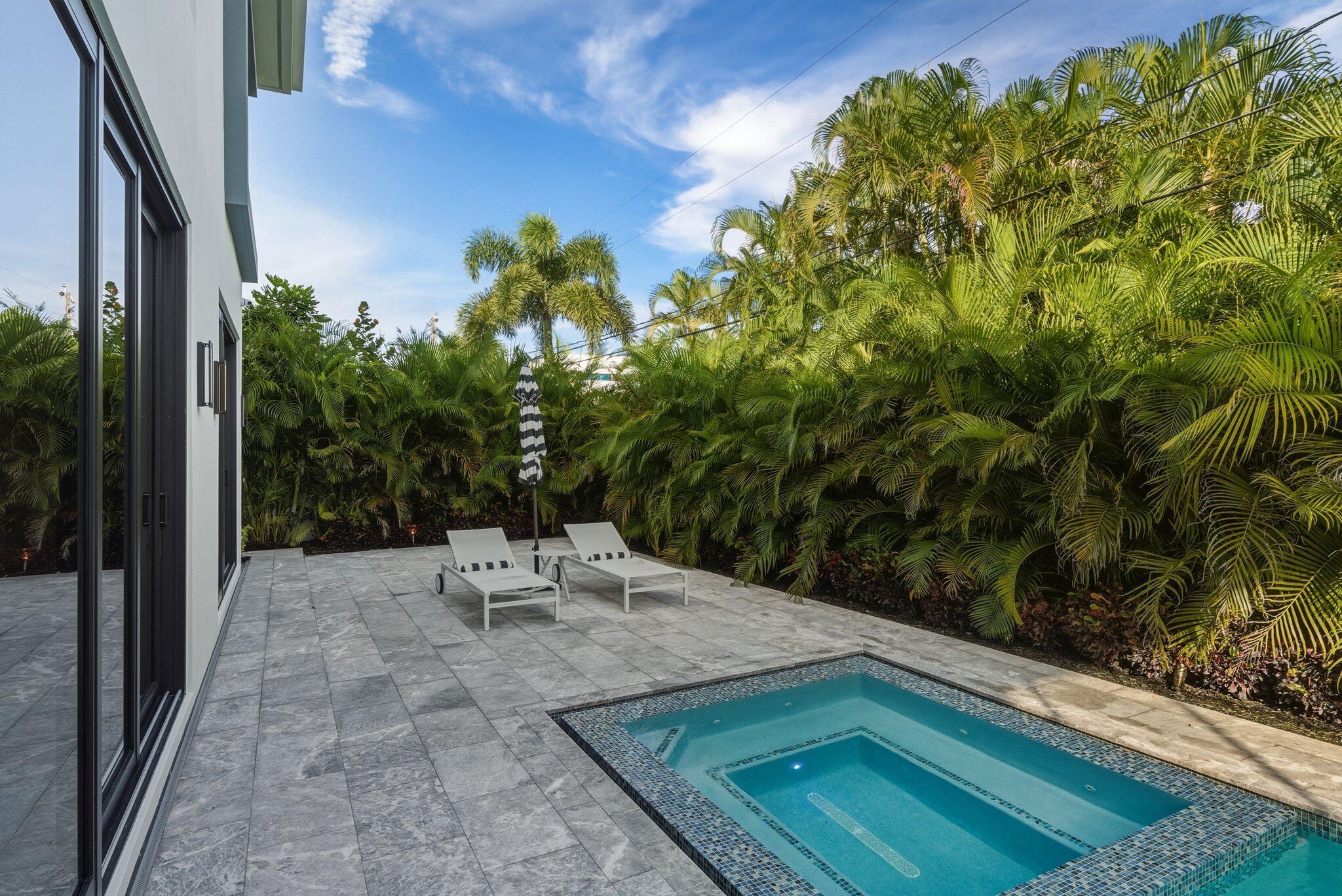 1050 Northeast 3rd Avenue Boca Raton, FL 33432 - Photo 43 of 63 a view of a backyard with sitting area