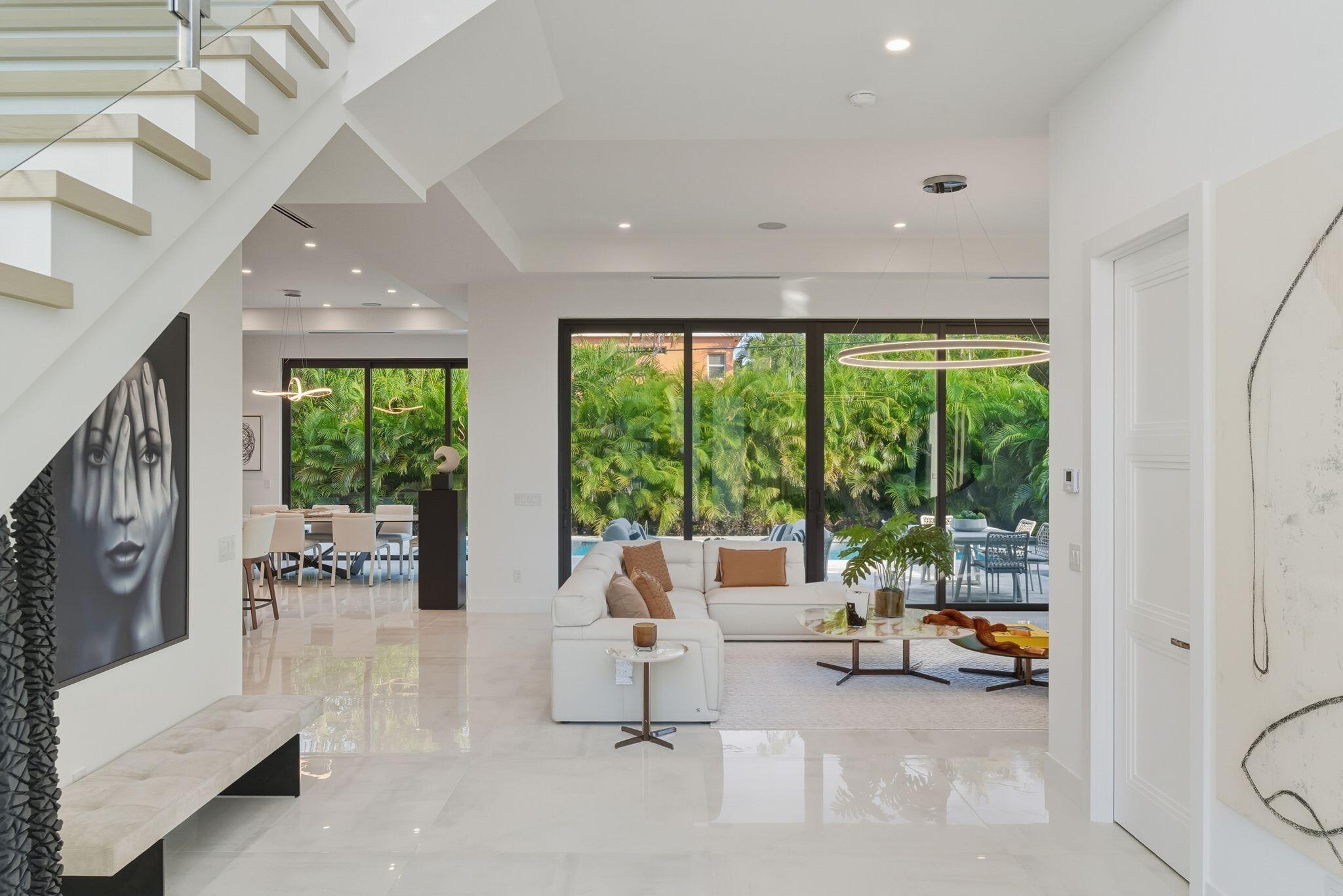 1050 Northeast 3rd Avenue Boca Raton, FL 33432 - Photo 48 of 63 a living room with furniture and a large window