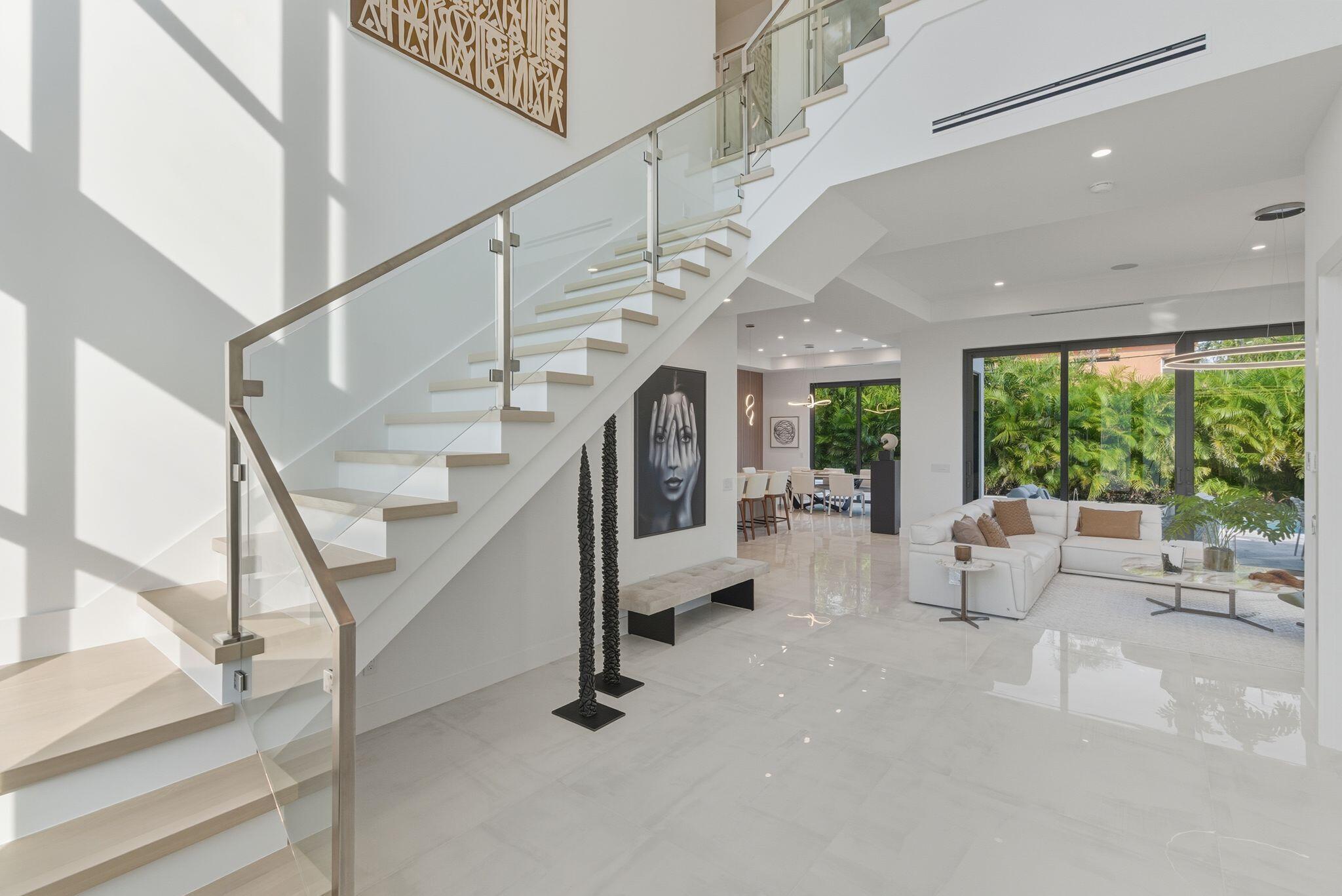 1050 Northeast 3rd Avenue Boca Raton, FL 33432 - Photo 49 of 63 a view of entryway and hall with wooden floor