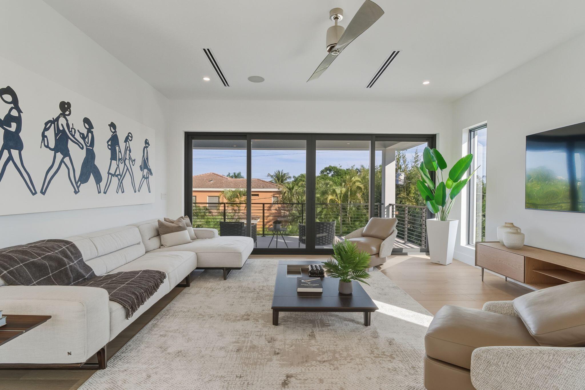 1050 Northeast 3rd Avenue Boca Raton, FL 33432 - Photo 52 of 63 a living room with furniture and a large window