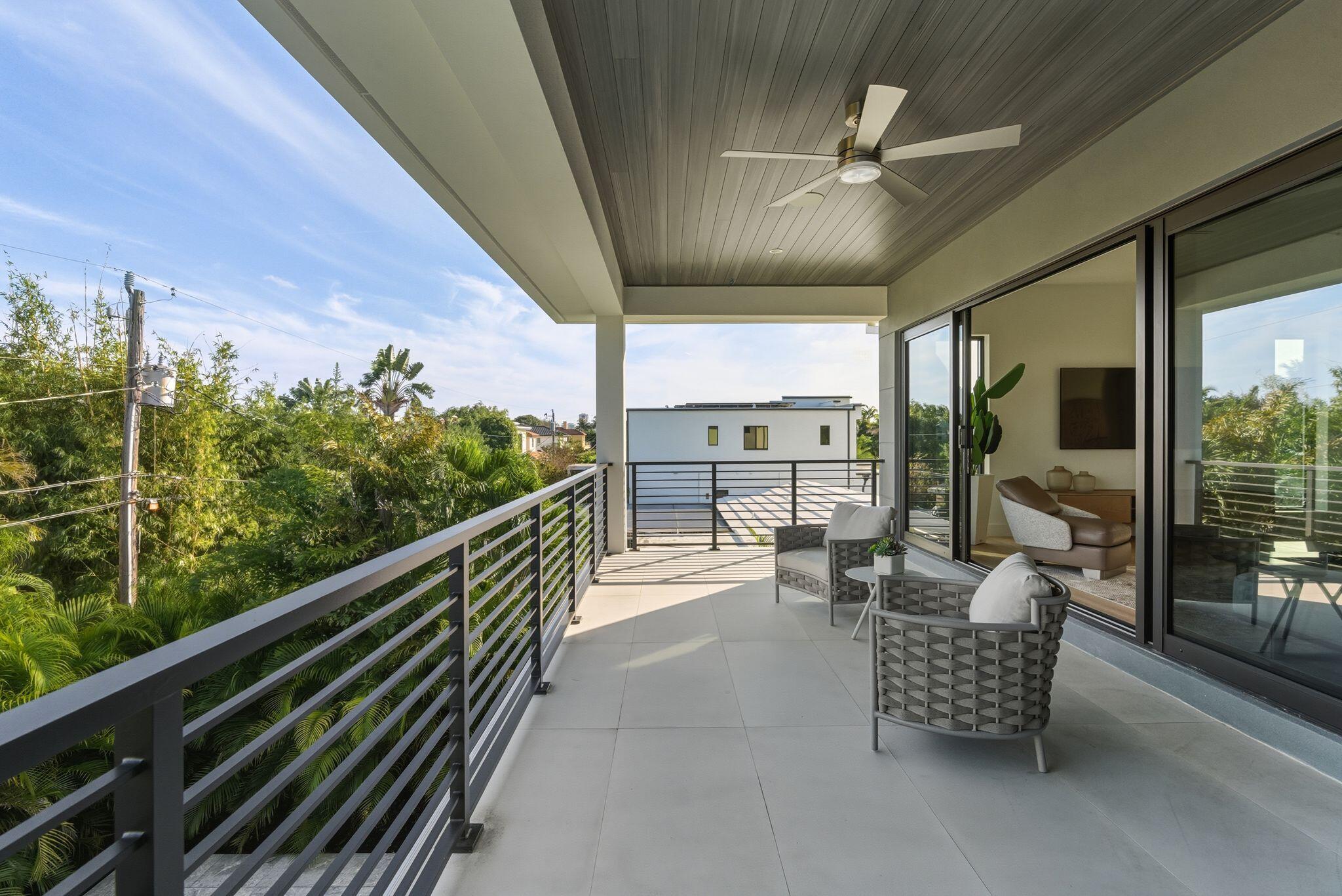 1050 Northeast 3rd Avenue Boca Raton, FL 33432 - Photo 55 of 63 a view of a chairs and table in the balcony