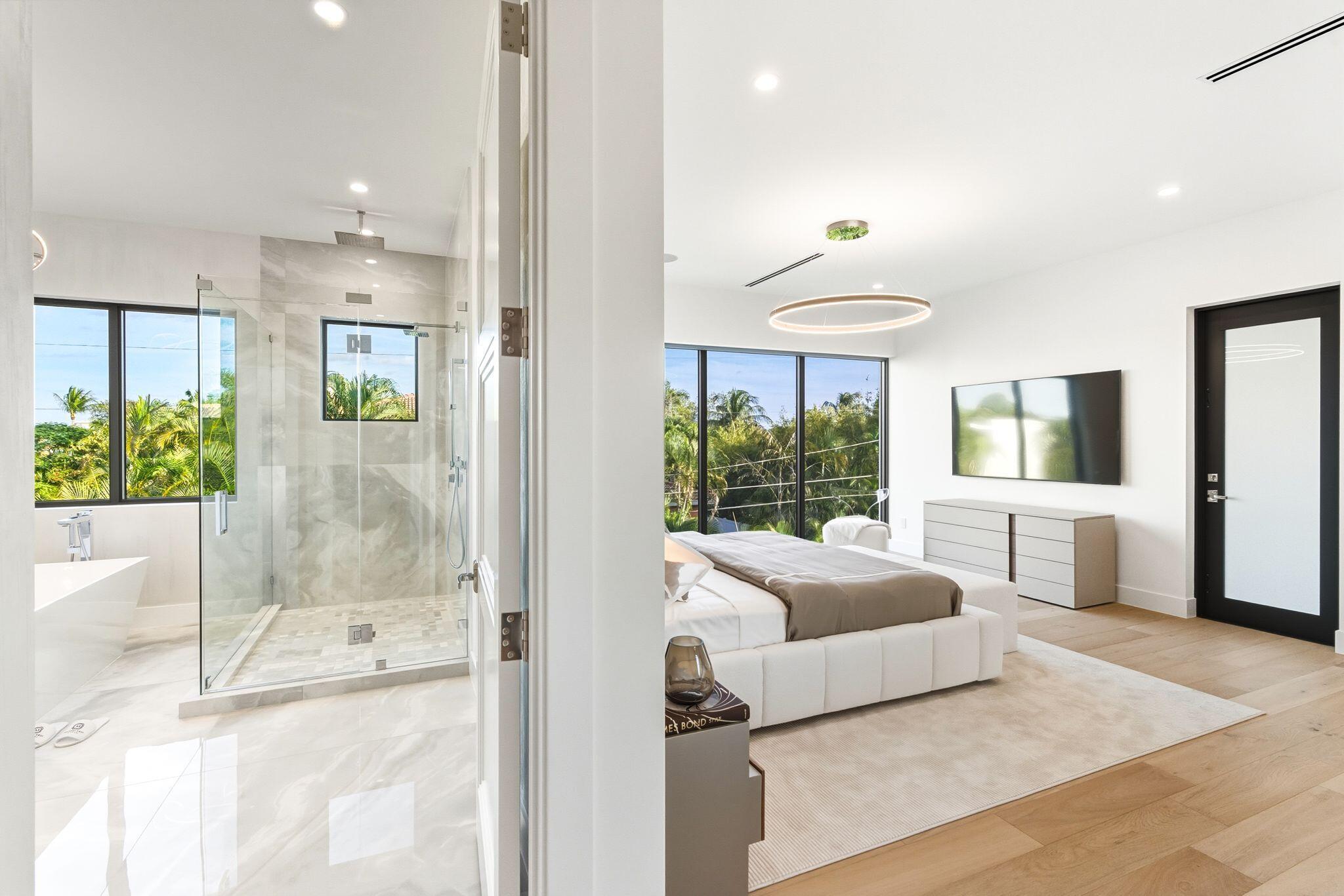 1050 Northeast 3rd Avenue Boca Raton, FL 33432 - Photo 63 of 63 a living room with furniture and a chandelier