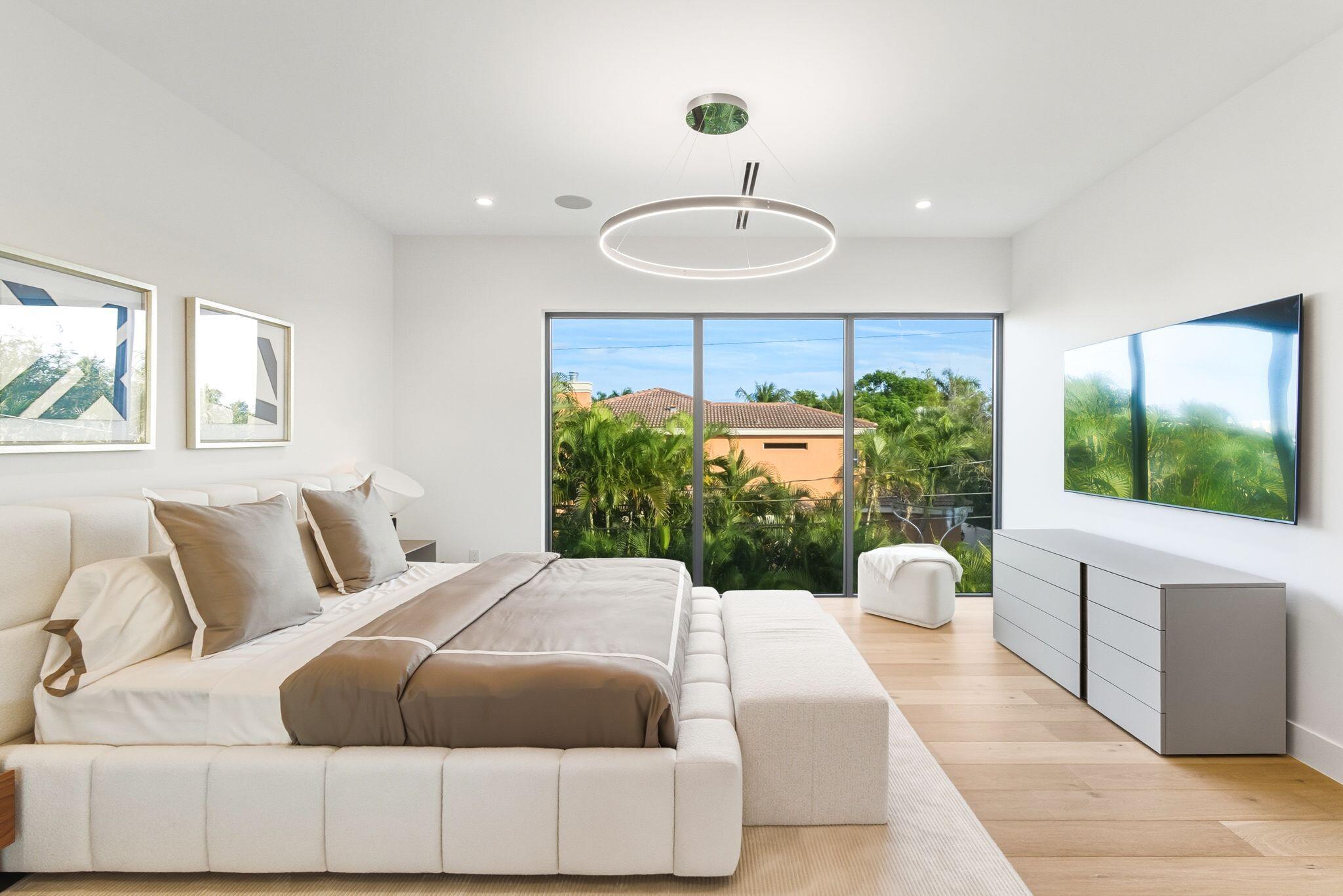 1050 Northeast 3rd Avenue Boca Raton, FL 33432 - Photo 9 of 63 a living room with a balcony and a large window