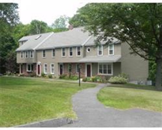 1 Meadowbrook Road, Unit 7 Grafton, MA 01519 - Photo 1 of 9 a front view of a house with a garden