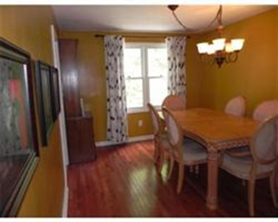 1 Meadowbrook Road, Unit 7 Grafton, MA 01519 - Photo 5 of 9 a view of a dining room with furniture window and wooden floor