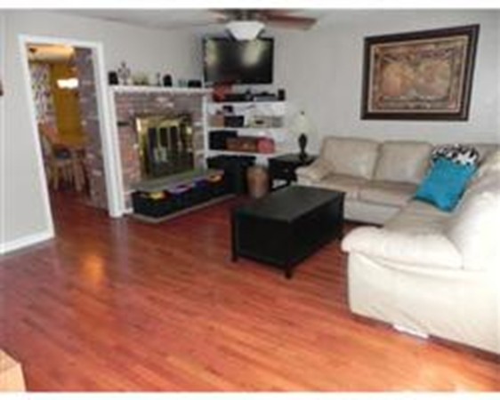 1 Meadowbrook Road, Unit 7 Grafton, MA 01519 - Photo 6 of 9 a living room with furniture and a fireplace