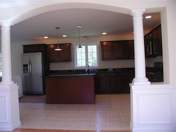 143 Lowell Road Salem, NH 03079 - Photo 5 of 9 a kitchen with stainless steel appliances kitchen island granite countertop a refrigerator and a sink
