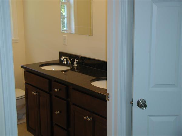 143 Lowell Road Salem, NH 03079 - Photo 6 of 9 a bathroom with a sink and a mirror