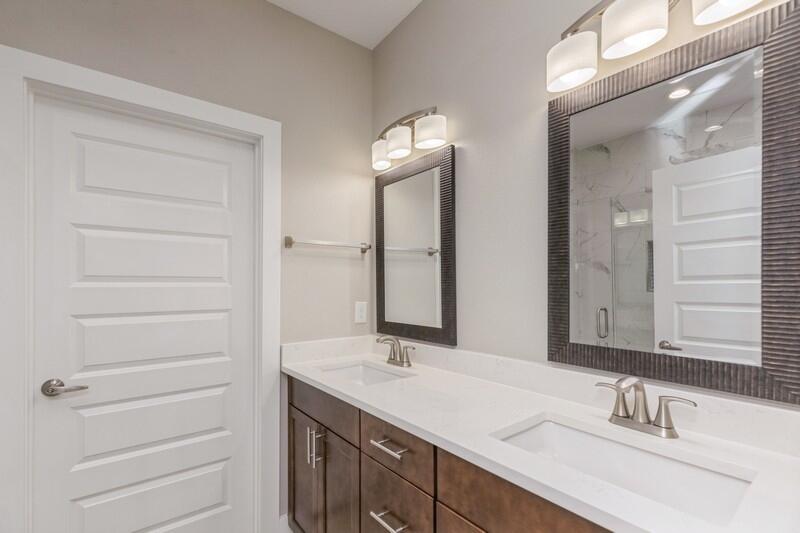 4540 Hermosa Road Crestview, FL 32539 - Photo 13 of 35 a bathroom with a double vanity sink and a mirror