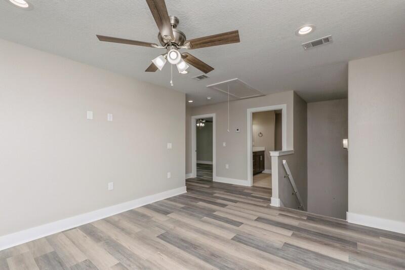 4540 Hermosa Road Crestview, FL 32539 - Photo 18 of 35 wooden floor in an empty room with a mirror