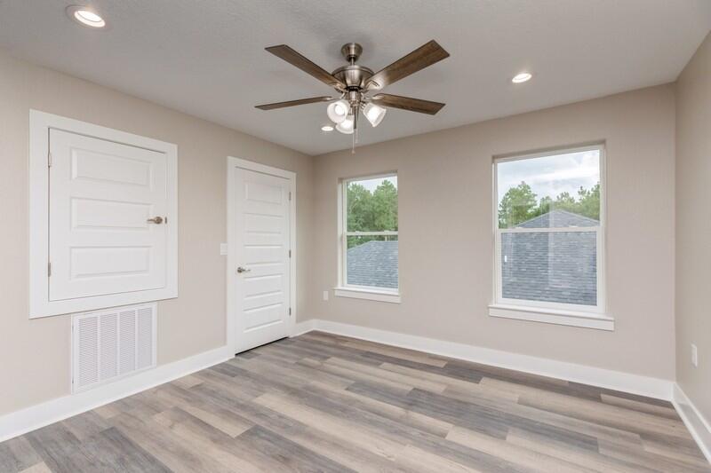 4540 Hermosa Road Crestview, FL 32539 - Photo 19 of 35 an empty room with window and ceiling fan