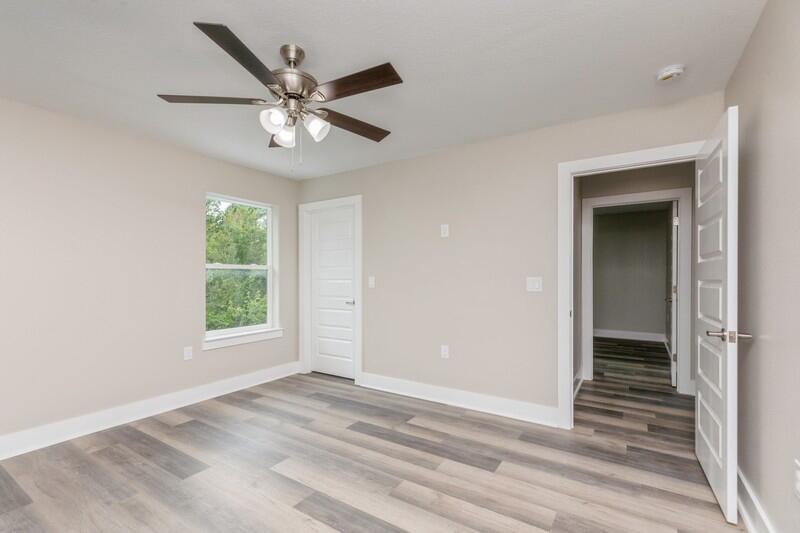 4540 Hermosa Road Crestview, FL 32539 - Photo 21 of 35 an empty room with a ceiling fan and a window