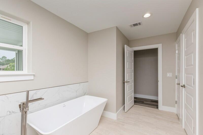 4540 Hermosa Road Crestview, FL 32539 - Photo 32 of 35 a bathroom with a bathtub and a shower