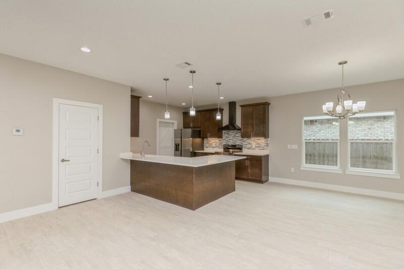 4540 Hermosa Road Crestview, FL 32539 - Photo 5 of 35 a large white kitchen with a large window