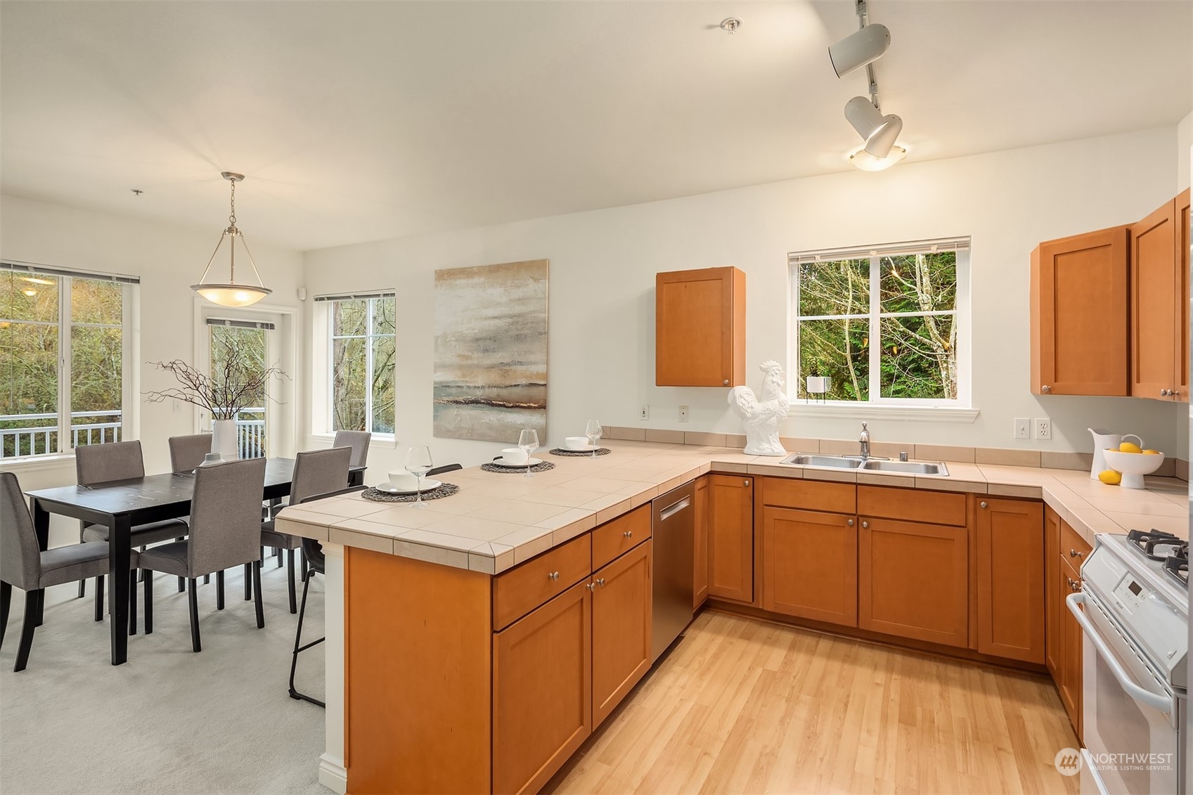 17432 Bothell Way Northeast, Unit B206 Bothell, WA 98011 - Photo 13 of 28 a kitchen with a sink stove and cabinets