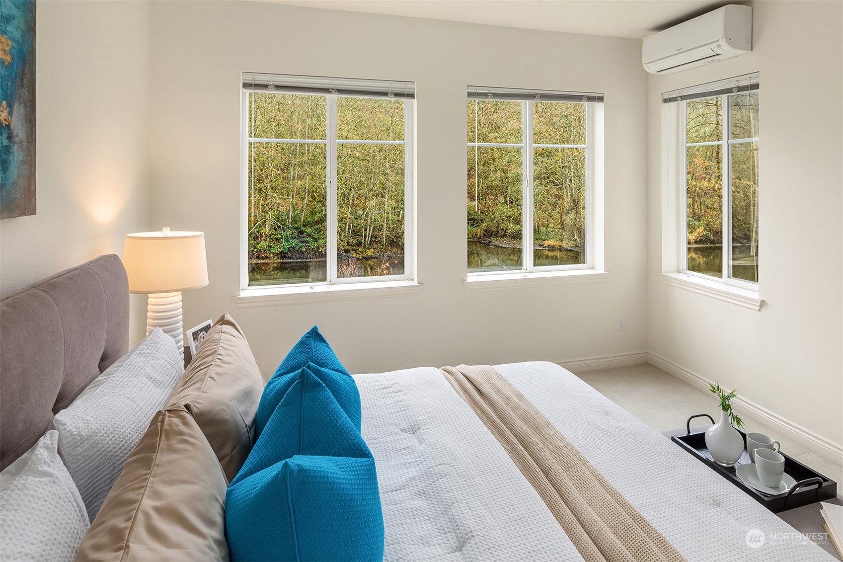 17432 Bothell Way Northeast, Unit B206 Bothell, WA 98011 - Photo 17 of 28 a bed sitting in a bedroom next to a window