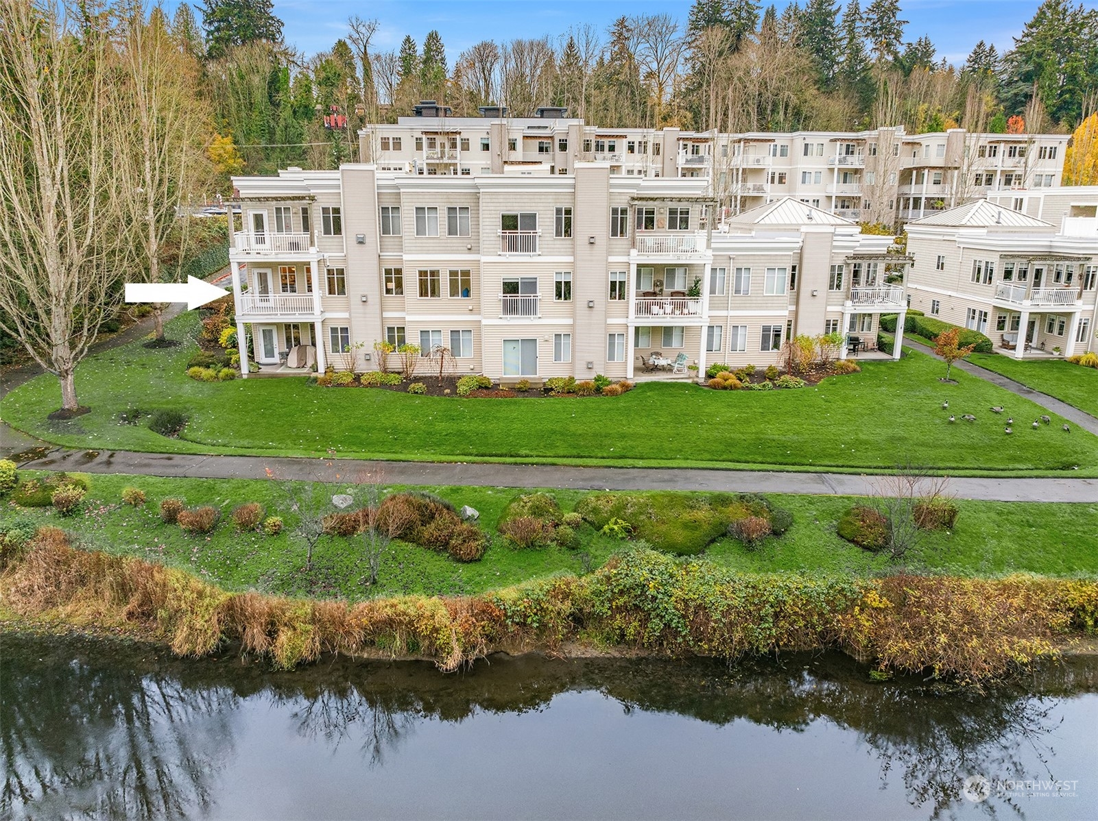 17432 Bothell Way Northeast, Unit B206 Bothell, WA 98011 - Photo 2 of 28 a view of building with outdoor space and lake