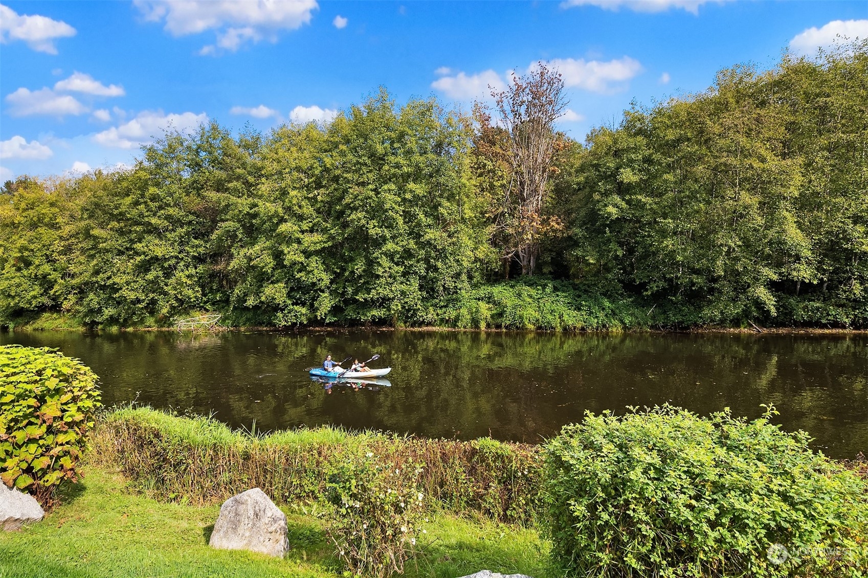 17432 Bothell Way Northeast, Unit B206 Bothell, WA 98011 - Photo 28 of 28 a view of a lake with houses
