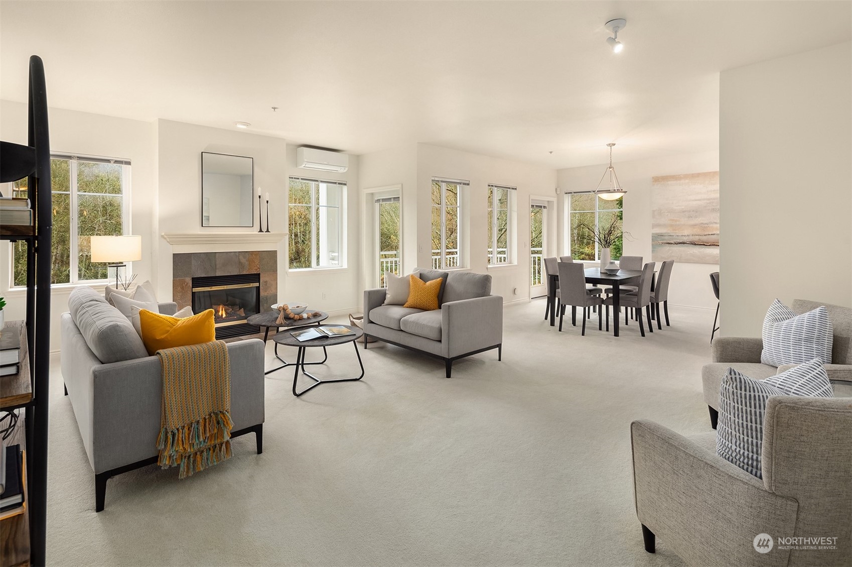 17432 Bothell Way Northeast, Unit B206 Bothell, WA 98011 - Photo 3 of 28 a living room with furniture fireplace and a flat screen tv