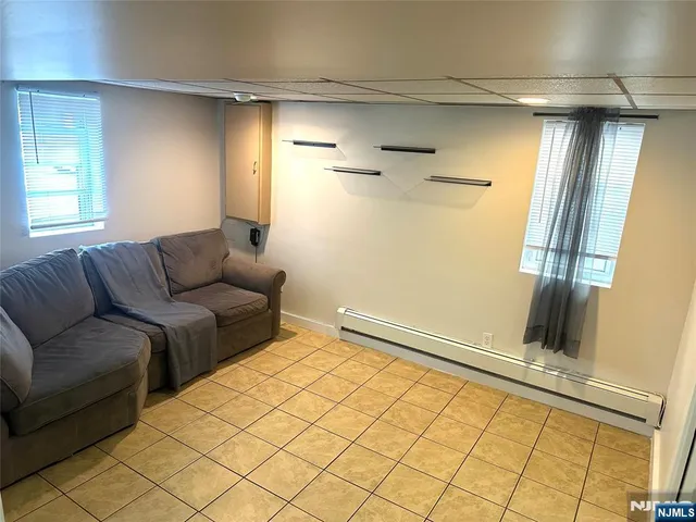 a living room with a couch and a shower