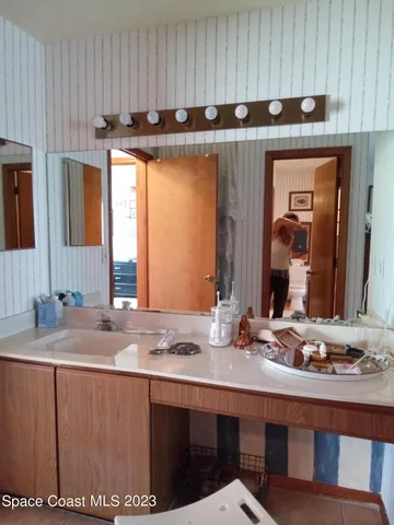 a kitchen with granite countertop a sink and a stove