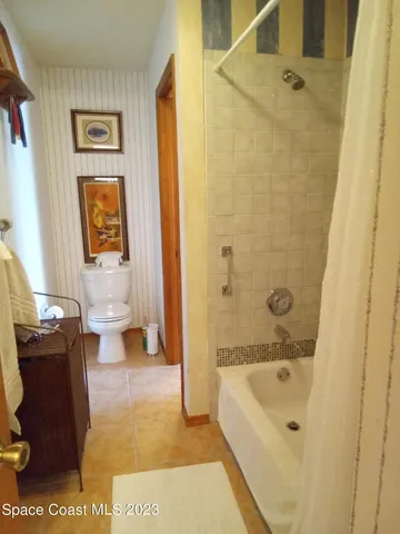 a bath room with a bath tub and a shower