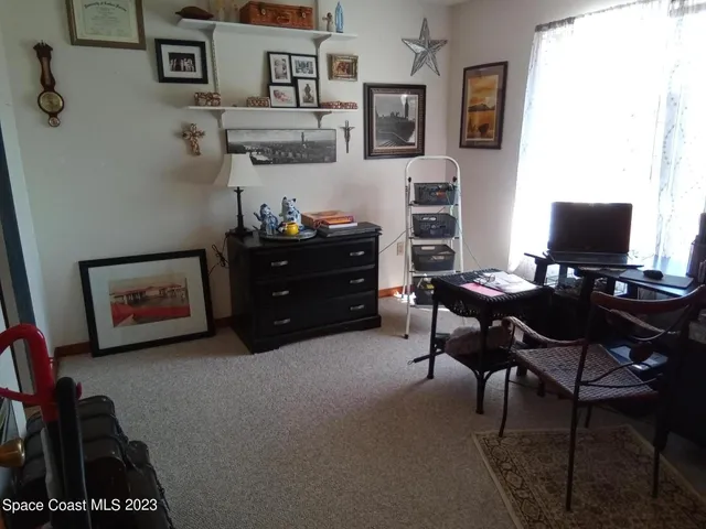 a room with furniture and a flat screen tv