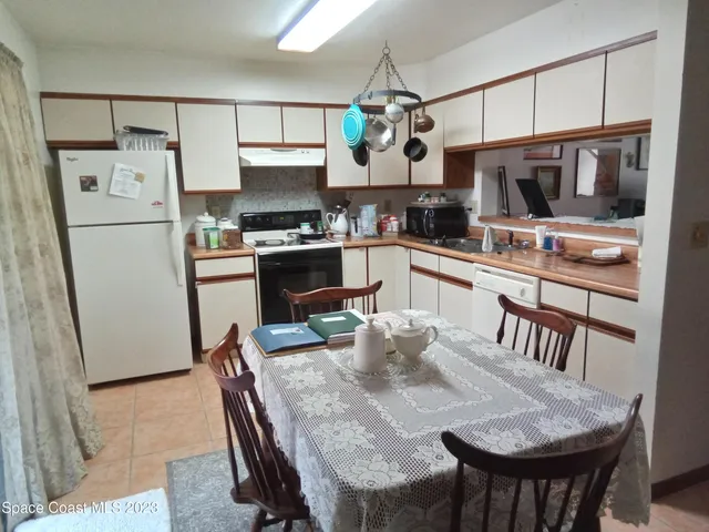 a outdoor living room with furniture and a window