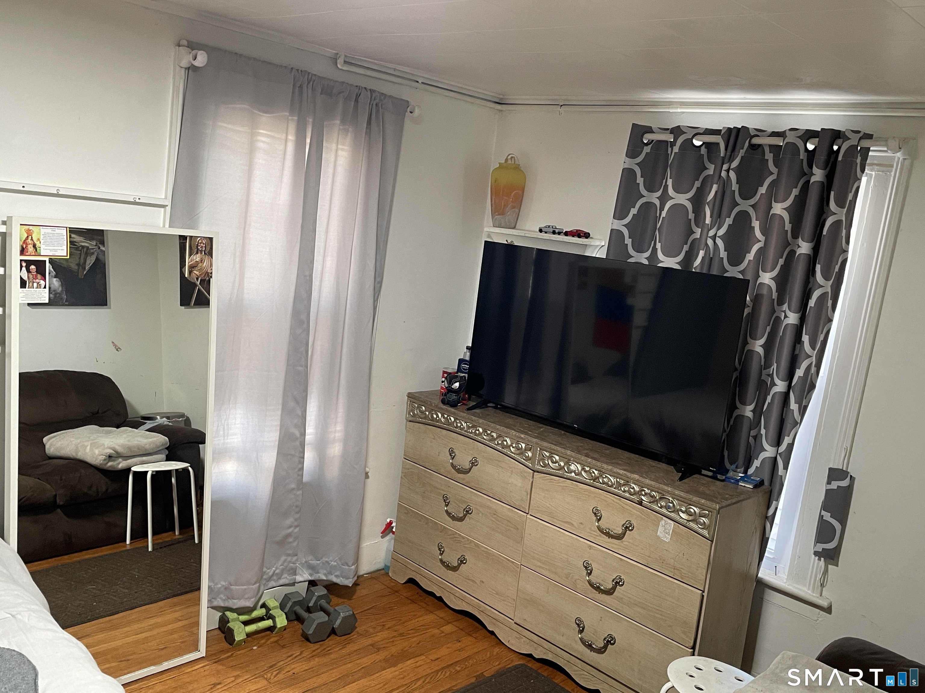 264 South Main Street Torrington, CT 06790 - Photo 22 of 39 a living room with furniture and a flat screen tv