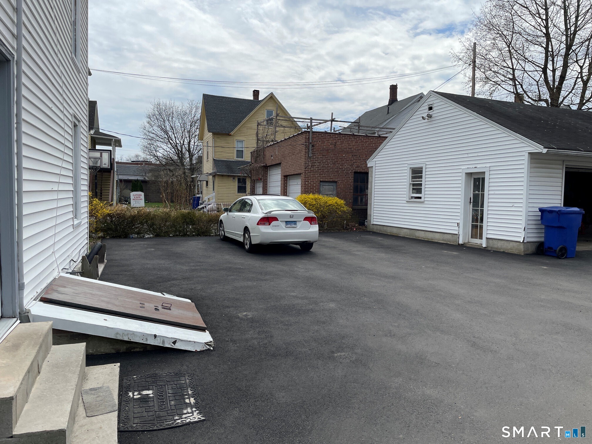 264 South Main Street Torrington, CT 06790 - Photo 3 of 39 a car parked in front of a house