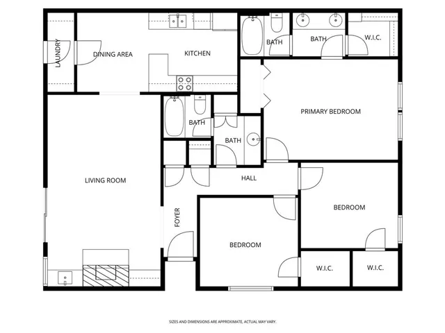 a view of an empty room with wooden floor fireplace and a window