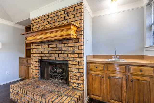 a kitchen with stainless steel appliances granite countertop wooden cabinets and a granite counter tops