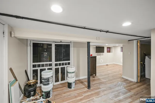 a view of workspace with wooden floor and windows