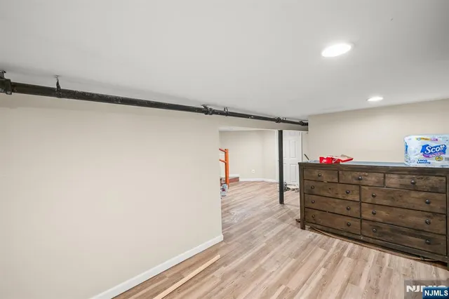 a bed room with a bed and a mirror