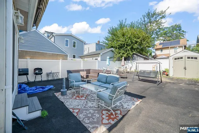 a view of living room filled with furniture and a potted plant