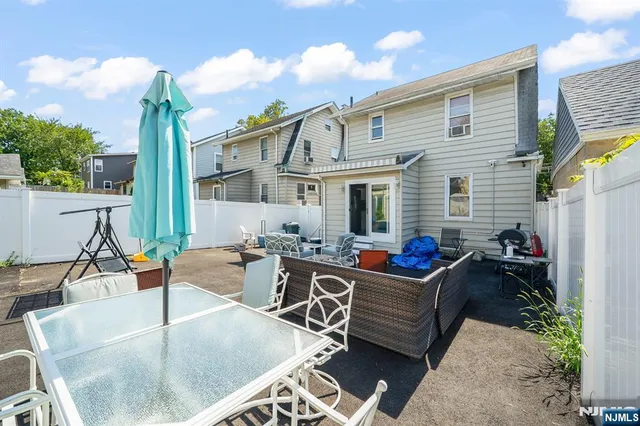 a view of a dinning table and chairs in patio