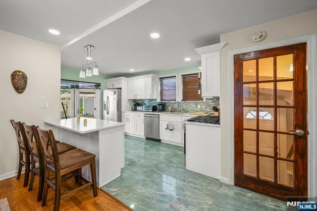 a kitchen with a table and chairs in it