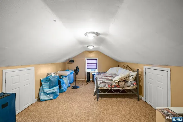 a bedroom with furniture and a chandelier