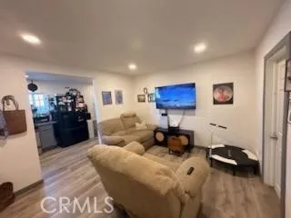 a living room with furniture and a lamp