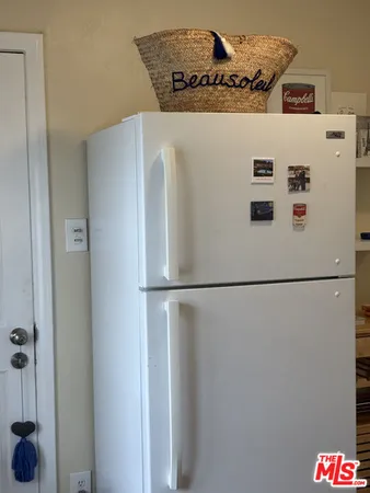 a white refrigerator freezer and a refrigerator