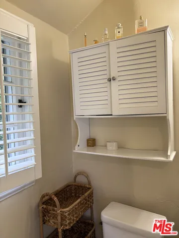 a bathroom with a sink and a chair