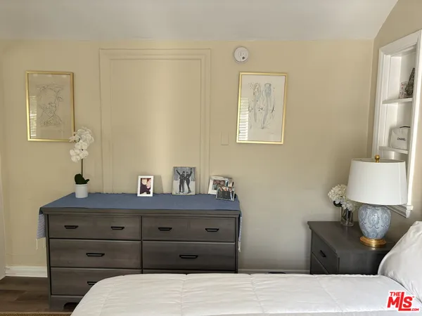 a bedroom with a bed and a table