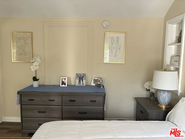 a bedroom with a bed and a table